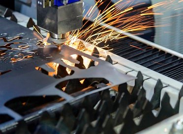 CNC laser cutting a metal sheet