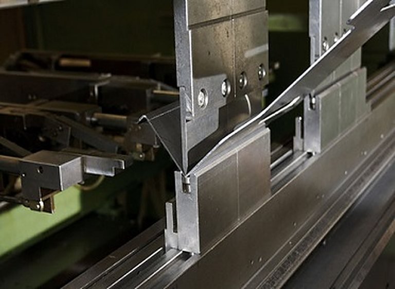 Press brake bending a steel sheet